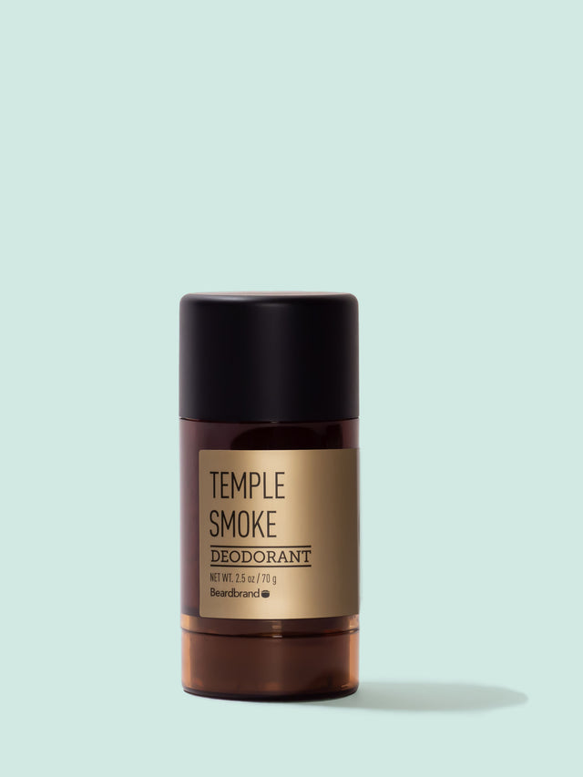 A round tube of Beardbrand Temple Smoke Deodorant on a striking blue backdrop.