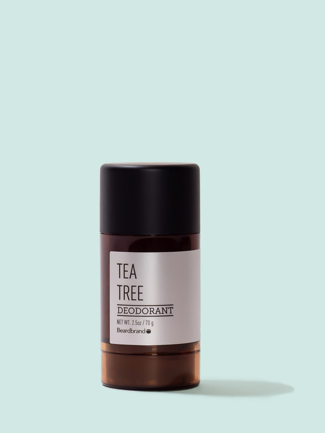 A round tube of Beardbrand Tea Tree Deodorant on a striking blue backdrop.